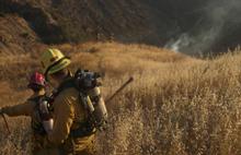 Ventura County firefighters monitor a hot spot on a mountain overlooking Fillmore. While geologists try to figure out why the area below the earth is burning, firefighters are monitoring the spot to ensure a brush fire doesn't ignite.